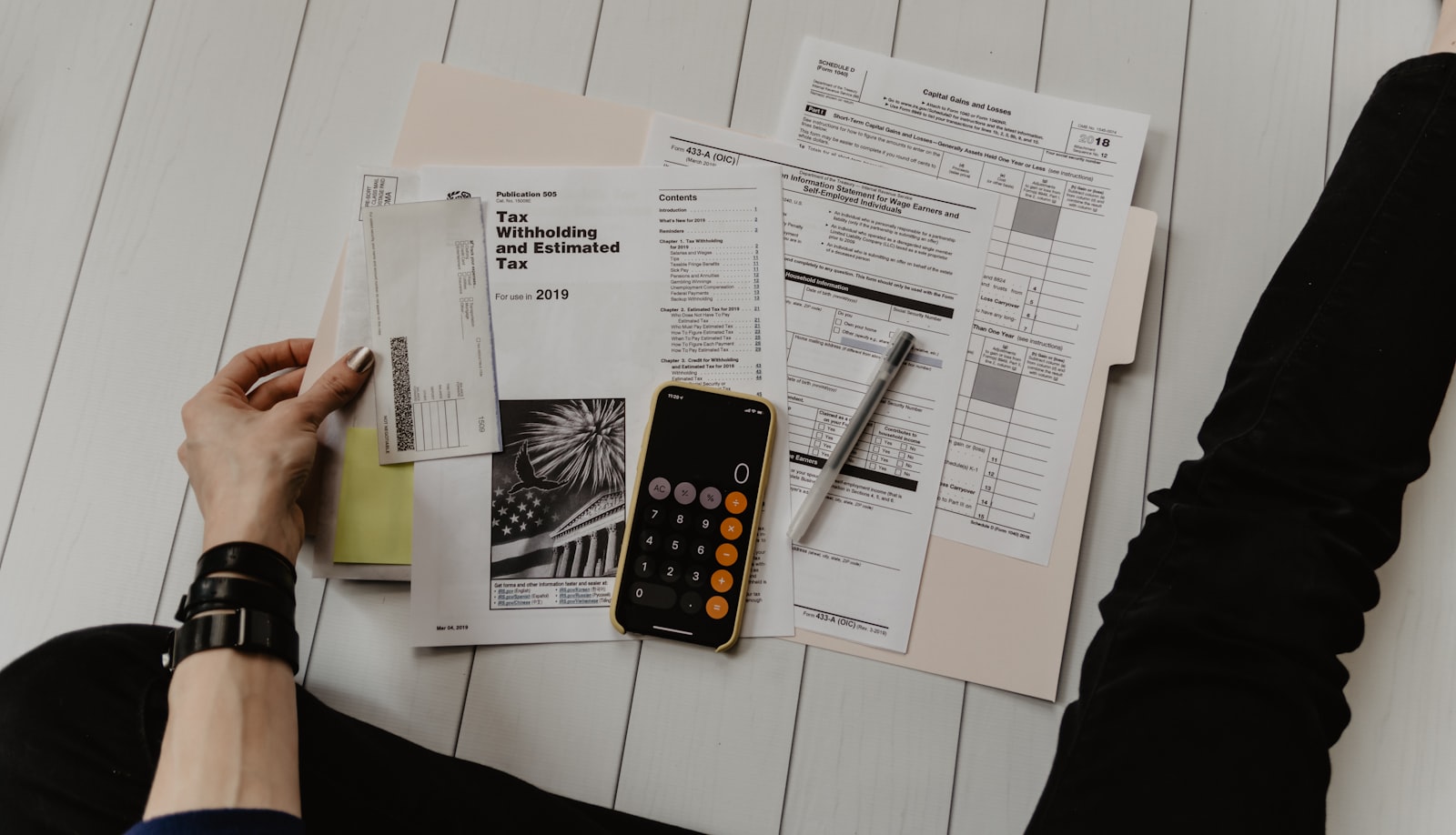 Financial planning documents and calculator on a desk